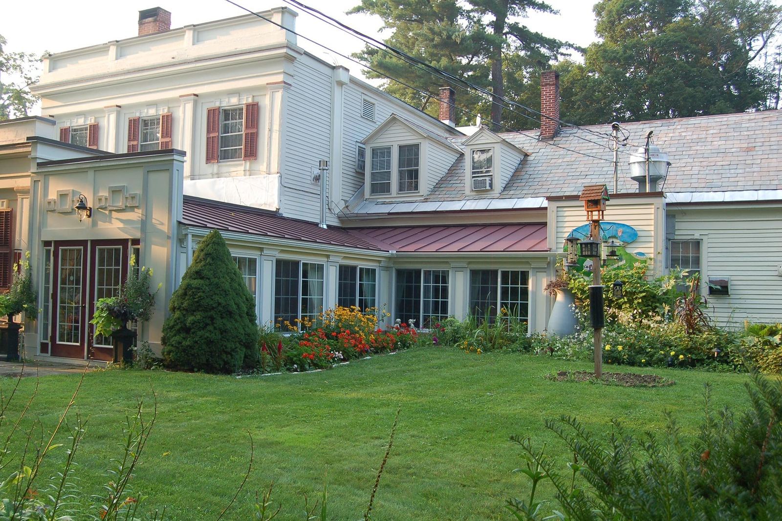 The Main House garden side with the breakfast solarium