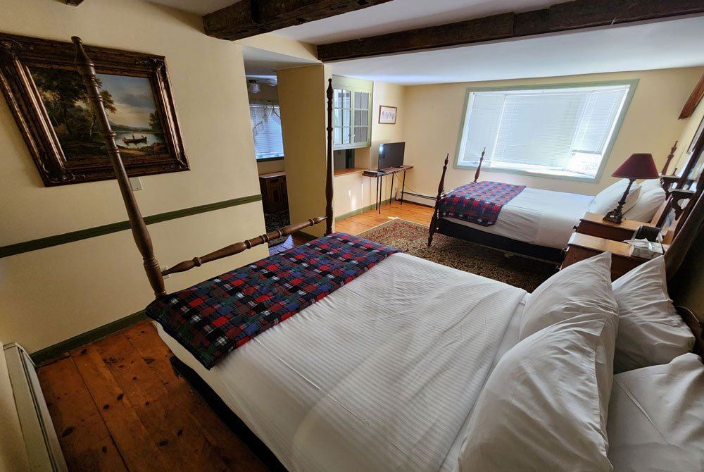 Rhoda's Room: four-poster bed with quilted bedding